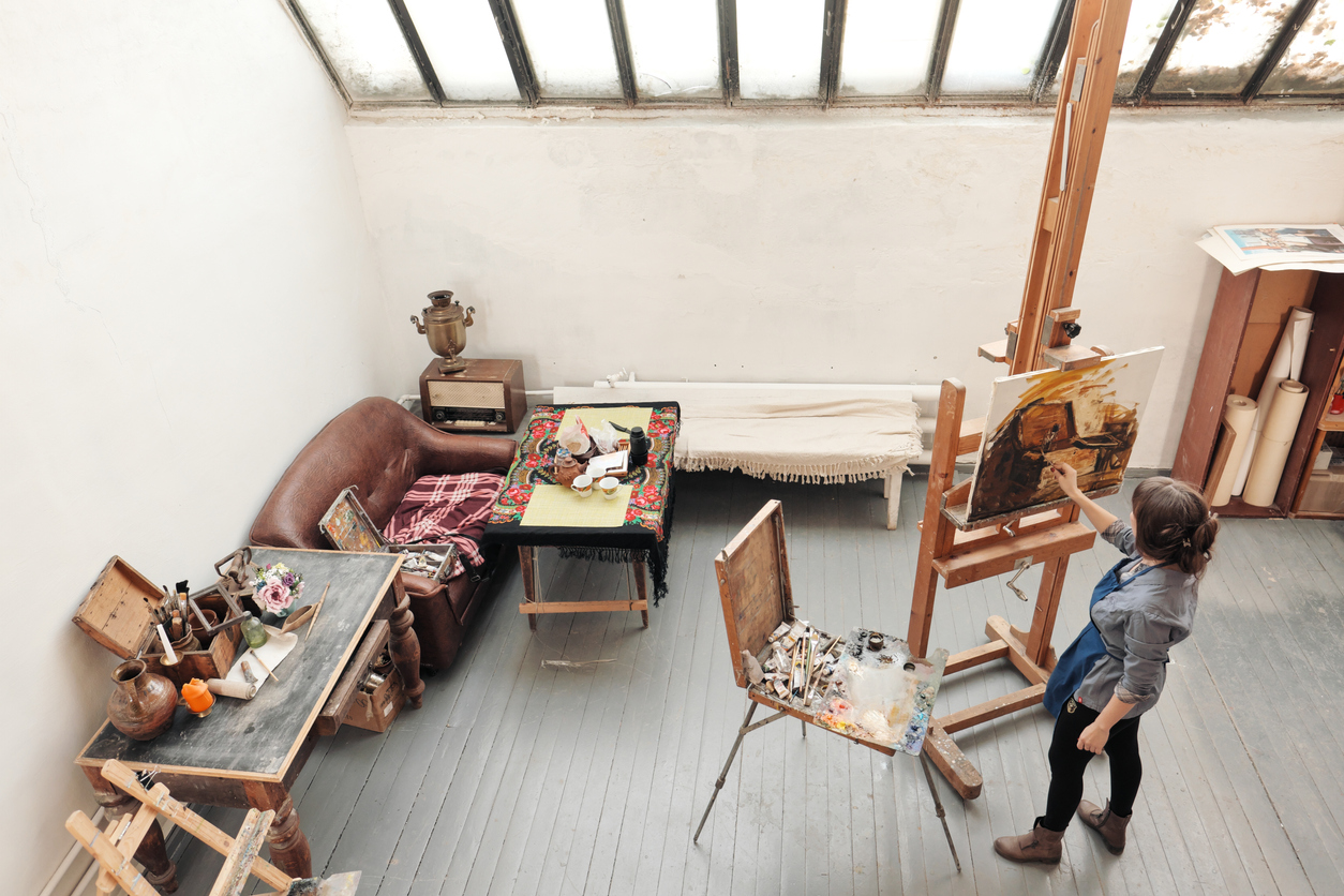 Fine arts student painting on canvas