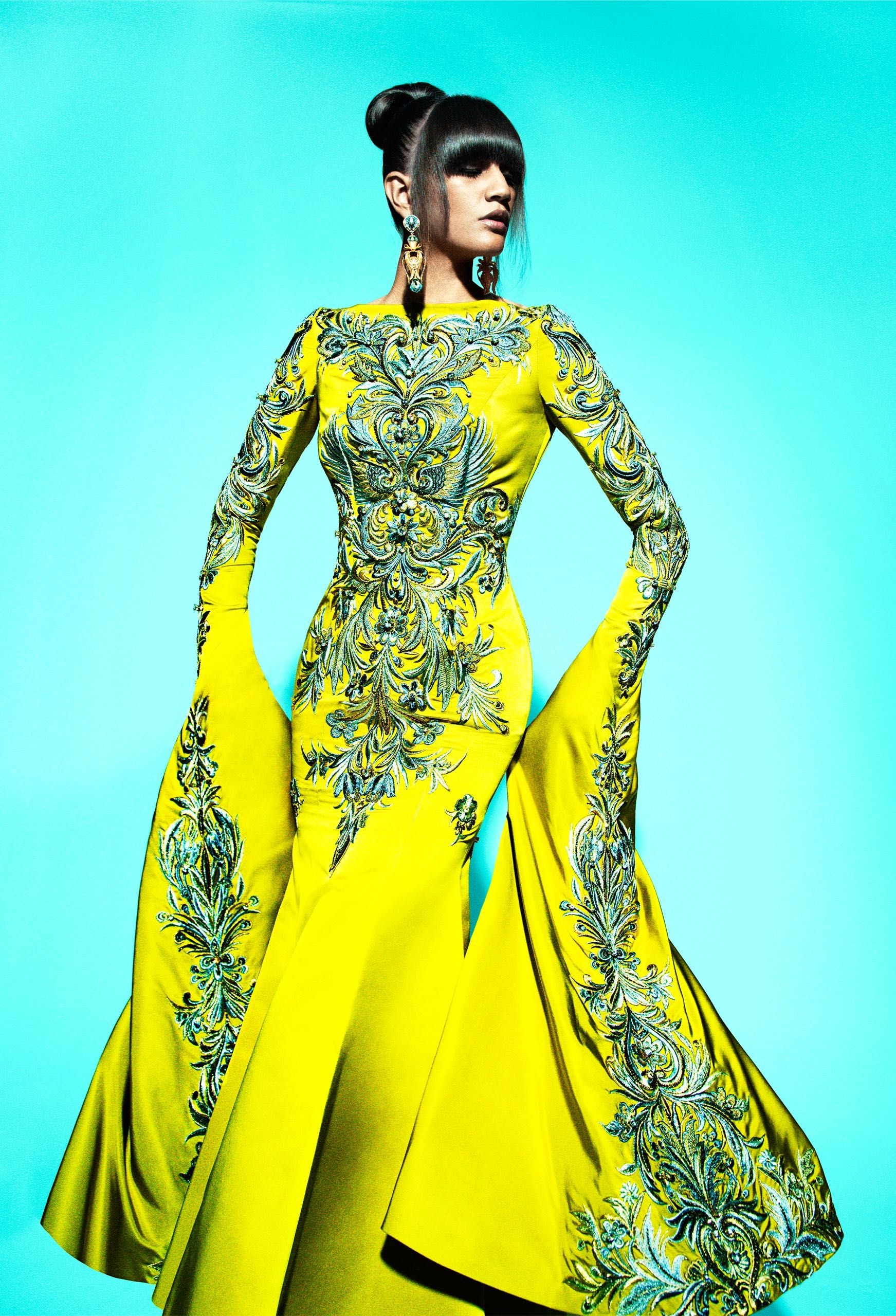 Senior student draping fabric on a stand