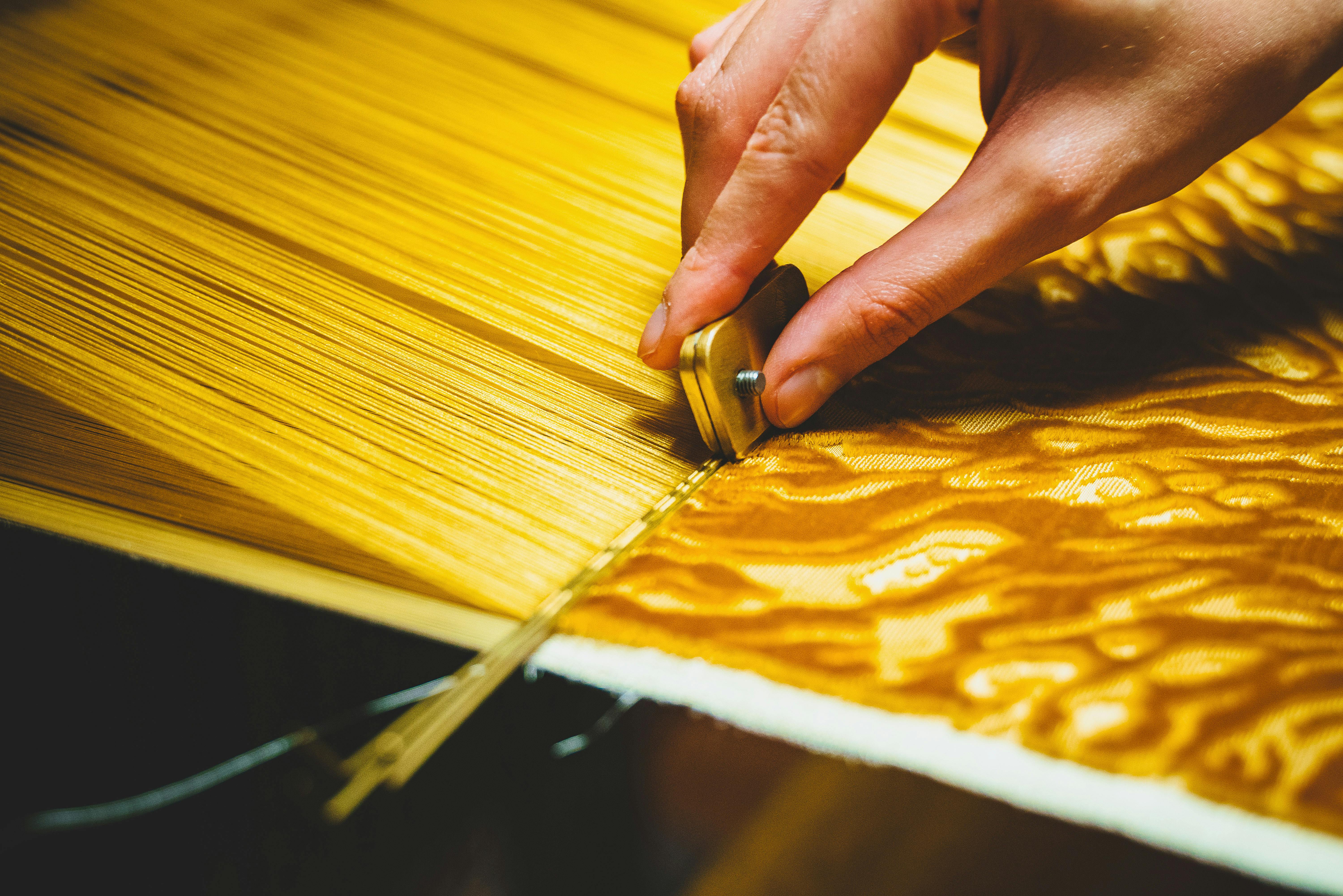 A fashion design student working at the atelier